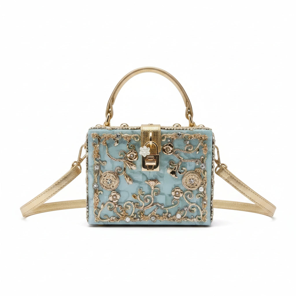 Decorative handbag with floral patterns and gold accents on a white background
