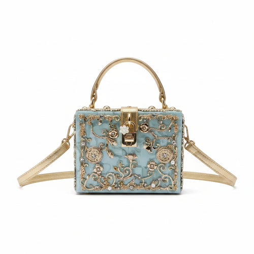 Decorative handbag with floral patterns and gold accents on a white background