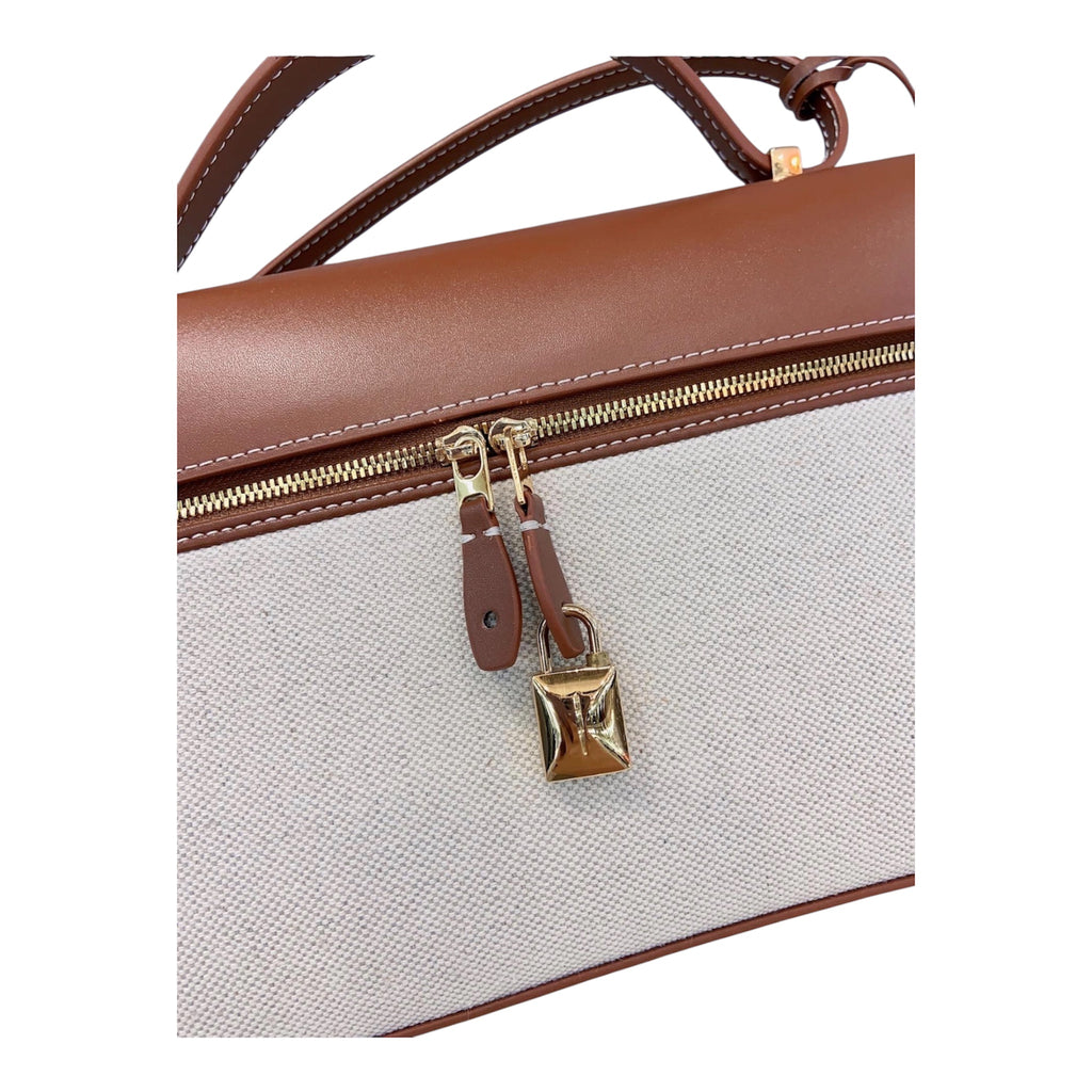 THE SIGNATURE SATCHEL